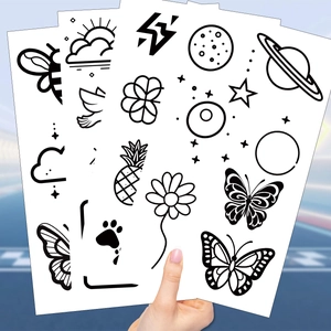 Tatuaggi temporanei neri e bianchi con icone di farfalla, stella e luna per bambini