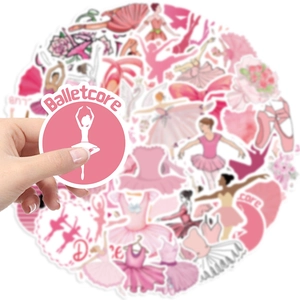 Hand holding a pink Balletcore sticker over a pile of assorted ballet-themed decals