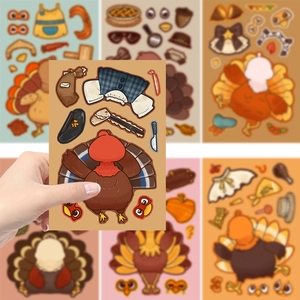 Close-up of a hand holding a DIY Thanksgiving turkey sticker sheet for kids' crafts