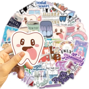 Macro shot of waterproof dental stickers featuring cartoon teeth and dentist tools