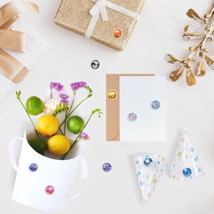 Colorful disco ball pattern stickers applied on gift boxes and party favors for decoration