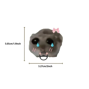 Close-up of waterproof sad hamster sticker with dimensions showing funny meme design