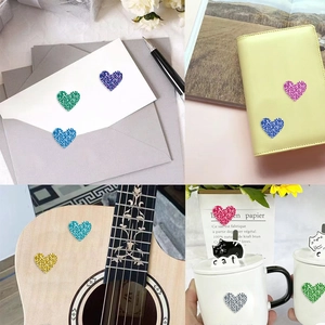 Glitter heart reward stickers on envelope, notebook and mug for colorful decoration
