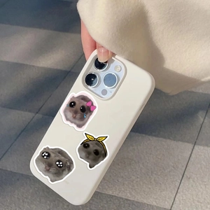 Close-up of creamy white iPhone case featuring cute cartoon hamster patterns on matte silicone