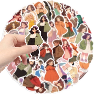 Hand holding cute cartoon girl sticker showing scale among 50 DIY waterproof decals