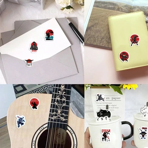 Rollo de 500 pegatinas de ninjas para decorar sobres, diarios y guitarras