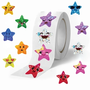 Roll of 500 laser star stickers with cute cartoon emoji faces for reward and decoration