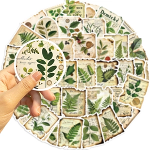 Detailed view of vintage botanical stickers with floral patterns for DIY scrapbooking