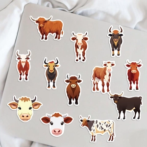 Flat lay of 12 waterproof cartoon cow stickers on a grey laptop cover with white border