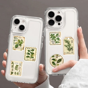 Macro view of clear phone case featuring vintage botanical stickers and plant illustrations
