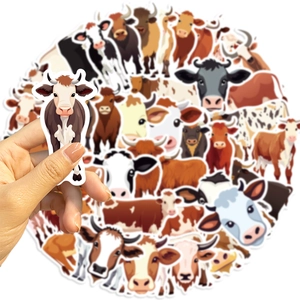Close-up of waterproof cartoon cow stickers for decorating laptops and luggage