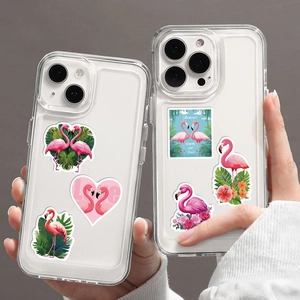 Detailed view of clear iPhone cases featuring vibrant pink flamingo and tropical patterns