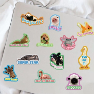 Cartoon animal reward stickers applied on laptop with vibrant colors and motivational text