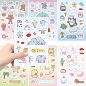 Close-up of cute cartoon elephant stickers for DIY journals and phone case decoration