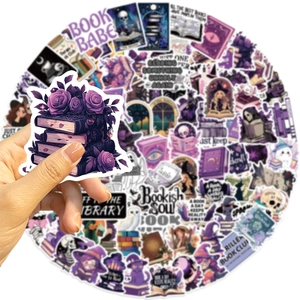 Close-up of purple magic book stickers and witch illustrations for scrapbooking