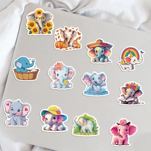 Detail showing 12 unique cartoon elephant stickers with waterproof matte finish on a laptop