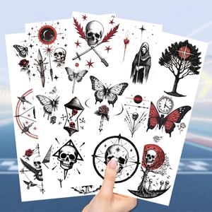 Detail showing a set of dark gothic skeleton temporary tattoos with butterflies and grim reaper