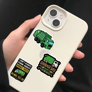Three waterproof cartoon garbage truck stickers applied to a white smartphone case
