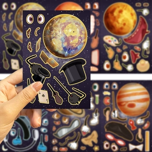 Close-up of DIY cartoon space planet sticker featuring magic hat and wand for journal decor
