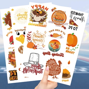 Macro view of Thanksgiving waterproof temporary tattoos with turkey and pumpkin designs