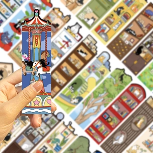 Hand holding a creative cat carousel bookmark with pink heart and geometric patterns