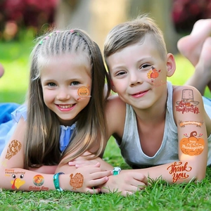 Detail showing waterproof Thanksgiving turkey and pumpkin temporary tattoos for children