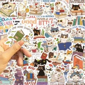 Detail showing a cartoon cat and book sticker with Just One More Chapter text