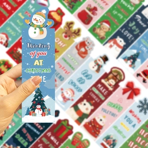Close-up of a 3D snowman bookmark with Christmas greetings and assorted holiday card series