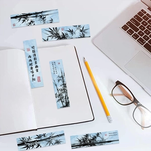Bamboo ink painting paper bookmarks set with calligraphy on a white notebook background