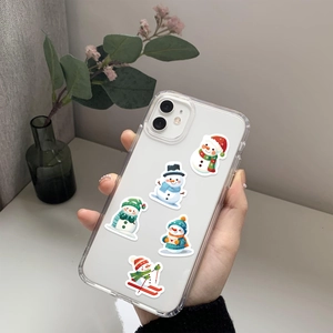 Detail of transparent iPhone case with festive cartoon snowmen patterns in winter outfits
