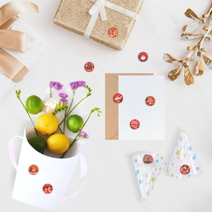 Detailed view of red Merry Christmas sealing stickers with festive holiday patterns