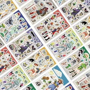 Close-up of DIY cartoon stickers with vintage newspaper texture and diverse illustrations