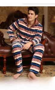 Detail of men's thick coral fleece pajamas featuring blue stripes and leopard print