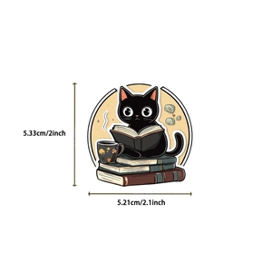 Close-up of a cartoon black cat reading on books sticker with 2-inch dimensions