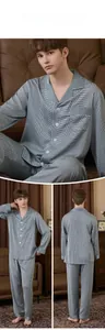 Close-up of silky men's pajama set featuring classic lapel design and geometric patterns