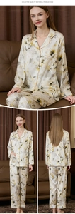 Detailed view of floral silk pajama set featuring button-up top and straight trousers