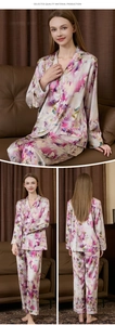 Detail view of women's silk pajamas featuring colorful floral patterns and lapel collar