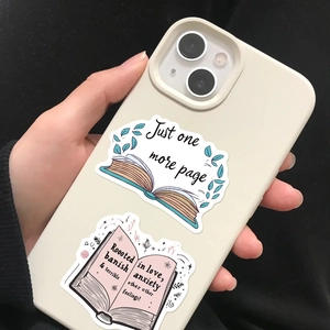 Detail of cream iPhone case decorated with book-themed stickers and reading quotes