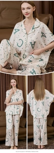 Detail view of cream silk pajamas featuring green letter prints and contrast piping