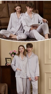 Detail of silk satin pajamas set with contrast piping and button-down front in light purple