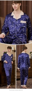 Detail of men's navy blue silk-like pajamas set with abstract matchstick pattern