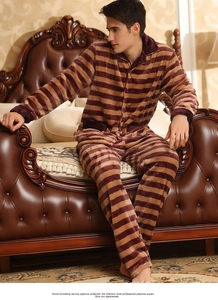 Detail of men's coral fleece striped pajamas with a warm flannel texture and lapel design