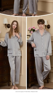 Close-up of elegant silver grey silk pajamas featuring contrast piping and refined button detail