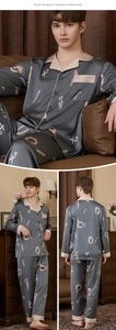 Detail of grey silk pajamas for men featuring gold trim and elegant letter printing