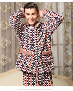 Detail of thick coral fleece men's pajamas with navy and orange geometric plaid patterns