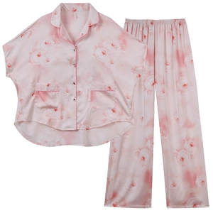 Women's two-piece pink silk pajama set with rose floral print and contrast piping