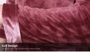 Close-up of flannel robe showing burgundy striped texture and velvet spliced cuffs