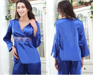 Detail of royal blue silk pajamas set with delicate purple lace trim and V-neckline