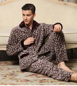Detail view of men's flannel pajama set featuring grey pebble pattern and velvet trim