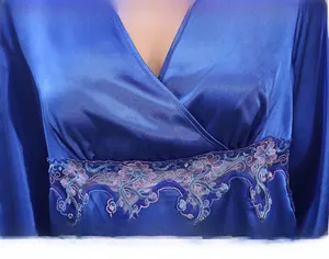 Detail of dark blue satin pajamas with purple floral embroidery and lace V-neckline